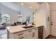 Bright kitchen featuring white cabinets, quartz countertops, and stainless steel appliances, perfect for modern living at 10239 W Fair Ave # A, Littleton, CO 80127