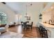 Open floor plan with a view of the dining area, kitchen, and seating, offering a functional design at 10239 W Fair Ave # A, Littleton, CO 80127
