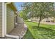 Scenic view of a well-maintained yard with mature trees and manicured grass at 10239 W Fair Ave # A, Littleton, CO 80127