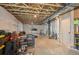Unfinished basement with exposed wood beams, concrete floor, and a variety of storage items at 4670 Tanner Peak Trl, Brighton, CO 80601