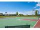 Vibrant basketball court with well-maintained surfaces, nets, and scenic neighborhood backdrop at 4670 Tanner Peak Trl, Brighton, CO 80601