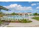 A sparkling community pool featuring plentiful lounge chairs and a playful splash area at 4670 Tanner Peak Trl, Brighton, CO 80601