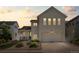 Charming two-story home with a front porch, attached garage and manicured landscaping at 4670 Tanner Peak Trl, Brighton, CO 80601