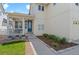 Inviting covered front porch with white railings and a vibrant blue front door at 4670 Tanner Peak Trl, Brighton, CO 80601