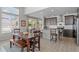 Eat-in kitchen area with granite countertops, stainless steel appliances, and sliding glass doors at 4670 Tanner Peak Trl, Brighton, CO 80601