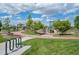 Gathering-friendly playground with slides, climbing structures, and walking paths at 4670 Tanner Peak Trl, Brighton, CO 80601