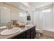 Clean bathroom with double vanity and shower/tub combo at 15162 Jakarta Cir, Parker, CO 80134