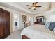 Main bedroom with ensuite bathroom access and ceiling fan at 15162 Jakarta Cir, Parker, CO 80134