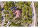 Stunning aerial view of a home nestled among lush green trees, close to the road at 110 Windwood Cir, Breckenridge, CO 80424