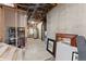 Unfinished basement with exposed pipes, storage and concrete walls, ready to be transformed at 110 Windwood Cir, Breckenridge, CO 80424