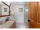 Cozy bathroom with a granite countertop sink and a glass-enclosed shower, enhanced by natural light at 110 Windwood Cir, Breckenridge, CO 80424
