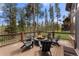 Deck features a cozy fire pit surrounded by chairs, perfect for outdoor gatherings at 110 Windwood Cir, Breckenridge, CO 80424