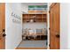 Mud room with custom shelving, bench, and cubbies for gear storage at 110 Windwood Cir, Breckenridge, CO 80424