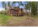 Beautiful exterior view of home with large deck and firepit at 110 Windwood Cir, Breckenridge, CO 80424