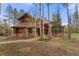 Beautiful exterior of mountain home with wood and stone architecture at 110 Windwood Cir, Breckenridge, CO 80424