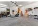 Spacious garage with tools, storage, and a staircase leading to another level, providing ample space at 110 Windwood Cir, Breckenridge, CO 80424