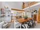 An open living space with a dining table and fireplace. Great for relaxing and entertaining at 110 Windwood Cir, Breckenridge, CO 80424