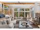 Inviting living room featuring an oversized sectional couch, coffee table and large windows with natural light at 110 Windwood Cir, Breckenridge, CO 80424