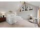 Serene main bedroom with vaulted ceilings, triangular windows, a king bed, and soft neutral tones at 110 Windwood Cir, Breckenridge, CO 80424