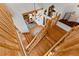 Unique log cabin style staircase and chandelier lead to the living area with cozy reading nook at 110 Windwood Cir, Breckenridge, CO 80424