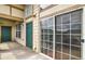 Patio with sliding glass doors and green doors at 3854 S Dayton Way # 308, Aurora, CO 80014
