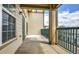 Outdoor balcony with views of the community, featuring a green metal railing at 3854 S Dayton Way # 308, Aurora, CO 80014