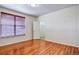 A bedroom with a closet, wood floors, and a window with blinds at 3854 S Dayton Way # 308, Aurora, CO 80014