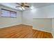 Bedroom featuring a ceiling fan, wood laminate flooring, and a window with blinds at 3854 S Dayton Way # 308, Aurora, CO 80014