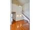 Bright living room with wood floors and staircase, with natural light at 3854 S Dayton Way # 308, Aurora, CO 80014