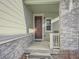 Front entry with stone accents and a wreath at 9008 Birch Run Dr, Parker, CO 80134