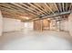 Unfinished basement with concrete floors, exposed beams, and framed-in spaces offering great potential at 5909 S Platte Canyon Dr, Littleton, CO 80123