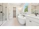 Bright bathroom featuring a freestanding tub, double vanity, and glass enclosed shower at 5909 S Platte Canyon Dr, Littleton, CO 80123