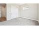 Cozy bedroom with neutral walls, carpet flooring, and a sliding door closet at 5909 S Platte Canyon Dr, Littleton, CO 80123