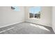 Bright and airy bedroom with a large window overlooking the neighborhood at 5909 S Platte Canyon Dr, Littleton, CO 80123