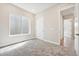 Well-lit bedroom with a window, closet, and a view into the hallway, creating an inviting atmosphere at 5909 S Platte Canyon Dr, Littleton, CO 80123