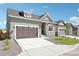 Attractive home showcasing a well-kept lawn, a cozy design, and a convenient driveway at 5909 S Platte Canyon Dr, Littleton, CO 80123