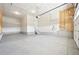 Bright and spacious two-car garage with concrete flooring, offering ample space for parking and storage at 5909 S Platte Canyon Dr, Littleton, CO 80123
