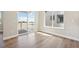 Spacious living area with sleek floors, patio access, and ample natural light at 5909 S Platte Canyon Dr, Littleton, CO 80123