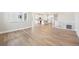Bright, open-concept living space showcases beautiful hardwood floors and a seamless flow to the kitchen at 5909 S Platte Canyon Dr, Littleton, CO 80123
