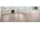 Open-concept living space with a fireplace, smooth floors, and plenty of sunshine at 5909 S Platte Canyon Dr, Littleton, CO 80123