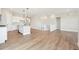 Spacious living area featuring an open kitchen, hardwood floors, and natural light at 5909 S Platte Canyon Dr, Littleton, CO 80123
