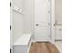Mud room area with bench, coat hooks, and entry to laundry room at 5909 S Platte Canyon Dr, Littleton, CO 80123