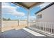 Open outdoor patio overlooking an undeveloped yard at 5909 S Platte Canyon Dr, Littleton, CO 80123