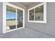 Covered outdoor patio with sliding glass doors and views of the yard at 5909 S Platte Canyon Dr, Littleton, CO 80123