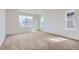 Spacious bedroom with neutral carpet, large window, white walls and trim, and abundant natural light at 2094 S Haleyville Way, Aurora, CO 80018