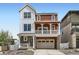Attractive home with a blend of stone, wood and siding, an attached two car garage and welcoming front porch at 2094 S Haleyville Way, Aurora, CO 80018