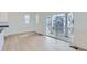 Bright, open-concept room with hardwood floors and a sliding glass door leading to outdoor living space at 2094 S Haleyville Way, Aurora, CO 80018