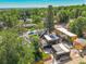 Aerial view showcases a modern home with solar panels surrounded by lush greenery at 1029 9Th St, Boulder, CO 80302