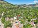 Expansive aerial view of property nestled among lush greenery with mountain backdrop at 1029 9Th St, Boulder, CO 80302