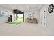 Finished basement with golf simulator, a dart board and neutral decor at 1029 9Th St, Boulder, CO 80302